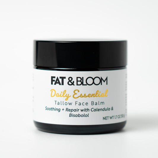 Fat & Bloom Daily Essential tallow face balm jar on a white background