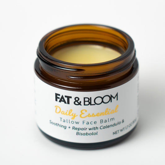 Open jar of Fat & Bloom Daily Essential Tallow Face Balm on a white background